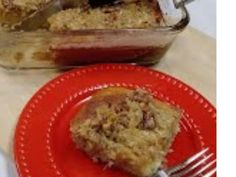 a piece of cake on a red plate with a fork