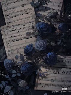 sheet music with blue roses and leaves on it in front of an old - fashioned piano