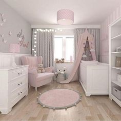 a baby's room with pink and white decor