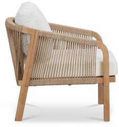 a wicker lounge chair with white cushions