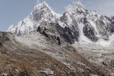 the snow covered mountains are high up in the sky, and there is no image to describe