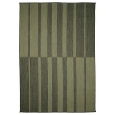 a green rug with vertical stripes on it