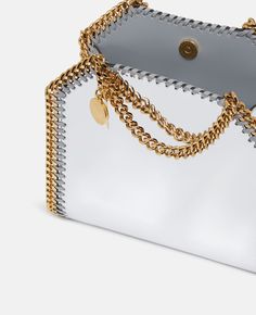 Discover Stella's Silver Falabella Mirrored Chrome-Finish Tote Bag today. Free standard shipping is available on all orders. Shop online now. Souvenir Jacket, Vegan Alternatives, Strawberry Print, Gold Logo, Japanese Artists, Goods And Services, Bago, Chrome Finish, Stella Mccartney