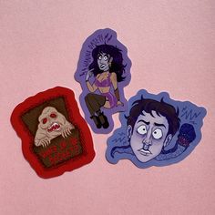 three cartoon stickers on a pink surface, one with an evil woman and the other with a creepy man