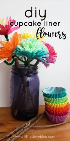 colorful paper flowers in a mason jar with the words diy cupcake liner flowers