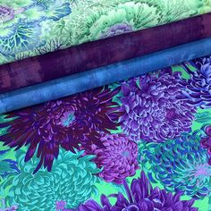 three different types of fabric with purple and green flowers on the bottom one is blue