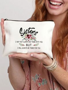 a woman holding up a pillow that says sisters i may not always be there with you