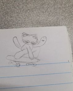 a drawing of a cat riding a skateboard on top of a piece of paper