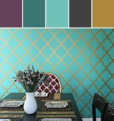 a dining room table with place settings and color swatches