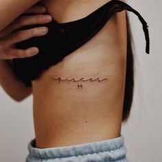 a woman's lower back tattoo with the word hope written in cursive font