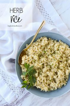 a blue bowl filled with rice and garnished with parsley