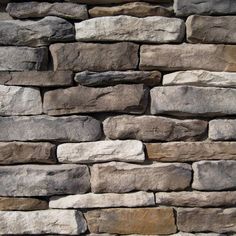 a stone wall that is made out of various types of rocks