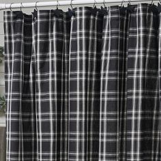 black and white plaid curtains hanging on a window