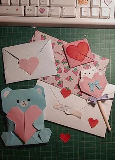 several pieces of paper with hearts and teddy bears on them