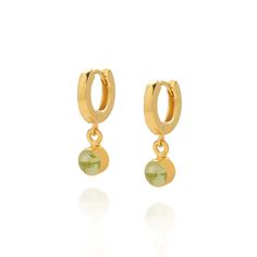 Celebrate your August birthday in style with these stunning Birthstone Gem Hoop Earrings featuring Peridot gemstones. Each natural gemstone is carefully hand-set by our skilled artisan silversmiths into sterling silver, creating a timeless and elegant present. These earrings are a beautiful and meaningful addition to any collection. Peridot: positivity | emotional well being | vitality We want your jewellery to stay in great condition so you can enjoy it for years to come. With some simple steps you can help prolong the life of your pieces. Remove your jewellery daily, put it on as the last step when getting ready and the first thing you take off at the end of the day. Avoid spraying with perfume and contact with creams and lotions and do not wear in water. When not being worn jewellery ca Hoop Earrings With May Birthstone Gemstone, May Birthstone Gemstone Hoop Earrings, Huggie Hoop Earrings With May Birthstone Gemstone, Birthstone Gems, Green Gem, August Birthday, Birthstone Earrings, Green Gems, Peridot Gemstone