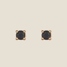 DescriptionBlack Crystal Studs feature a black crystal stone and are delicate and dainty enough for a second or third piercing but shiny enough to stand on their own. Now available in two sizes. Model is WearingBlack Crystal Studs, MiniClassic Crystal Studs, Mini Mini Black Earrings, Trendy Black Stud Jewelry, Black Stud Gold Earrings, Adjustable Black Studs Jewelry, Third Piercing, Black Crystal Earrings Studs, Nickel And Suede, Lightweight Earrings, Crystal Stone