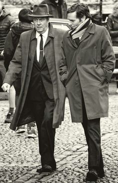 black and white photograph of two men walking together