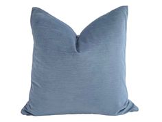 a blue pillow on a white background