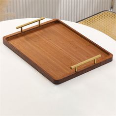 a wooden tray sitting on top of a white table