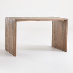 a wooden table sitting on top of a white floor