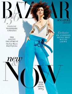 an image of a woman on the cover of bazaar magazine, wearing blue pants and a white top