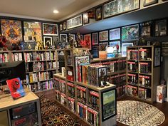 a room filled with lots of books and video games