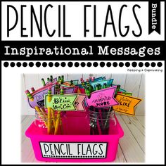 a pink container filled with pens and writing on top of a white table next to a black and white sign that says pencil flags