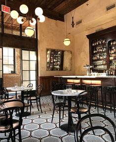 an empty restaurant with many tables and chairs