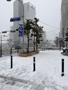 a city street with snow on the ground