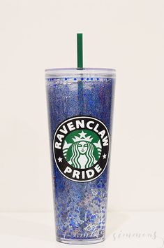 a starbucks cup with blue speckles and a green straw