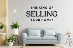 a living room with a couch, table and potted plants on the wall that says thinking of selling your home?