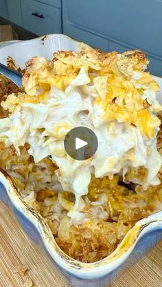 a casserole dish filled with food sitting on top of a wooden table