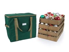 two boxes filled with christmas ornaments next to one box full of bauble ornaments