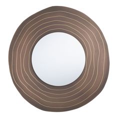 a round mirror with brown lines on it