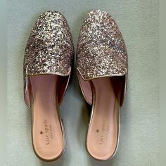 a pair of women's shoes with glittered upper part and pointed toed toes