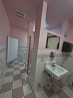 a bathroom with pink walls and tiled flooring is shown in this image, there are mirrors on the wall above the sink