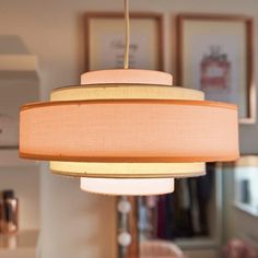 a light fixture hanging from the ceiling in a living room