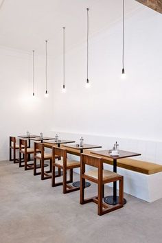 a restaurant with tables and stools in the middle of an empty room that says simply modified cafe concept