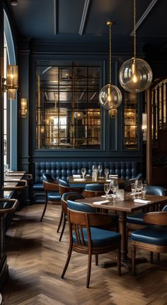 an empty restaurant with blue booths and wooden tables set up for two people to eat