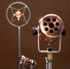 a close up of a microphone on a tripod with a star in the background