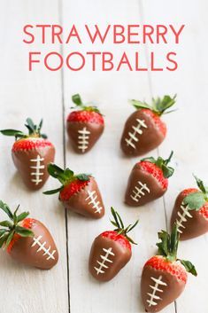 chocolate covered strawberries are arranged in the shape of footballs on a white table