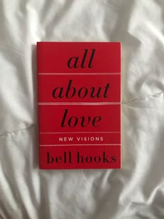 all about love by bell hooks on a white bed sheet with the words'all about love'written in black