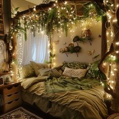 a bed with lots of lights hanging from it's headboard and pillows on top of it