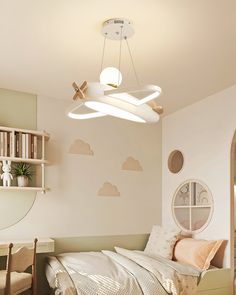 a bedroom with a bed, desk and chair in it's corner area next to a book shelf