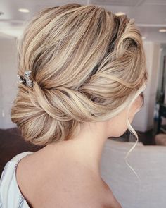 Gorgeous twisted chignon with a sparkly hair accessory. Get ready for the holidays with these 10 gorgeous holiday hairstyles! From Christmas hair inspo to chic ponytails, curls, and festive hair ideas, these looks are perfect for any celebration. Whether you need last-minute glam or creative hair ideas, you'll love these trending styles! 🎀✨ #HolidayHairstyles #ChristmasHair #HairInspo #HairIdeas #FestiveLooks