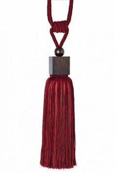 a red tasselle hanging from a metal hook