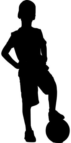 the silhouette of a person standing with their hands on their hips and holding a soccer ball