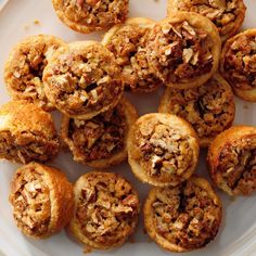 a white plate topped with lots of pastries