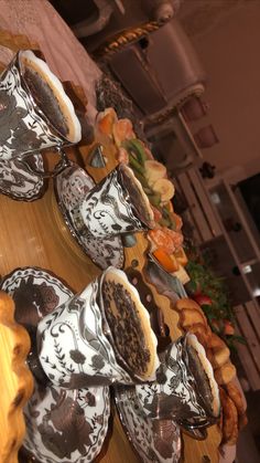 several decorative plates are lined up on a table