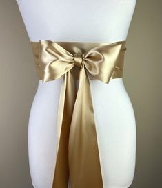 "Gold Sash, Gold Satin Sash  Light Gold Wedding Dress Sash Belt  Satin Sash, Gold Bridal Sash  Obi Sash Belt in Gold  Satin Swank  Make this Satin Swank® reversible waist sash the perfect finishing touch for your wedding, bridesmaid, or special occasion dress, or just the right piece to add instant polish to your dress or top.  This extra long version is 3.5 inches wide, 120 inches long, and will wrap around most waist sizes two times with a generous length remaining to tie in a bow or a simple Satin Sashes For Bridesmaids, Wedding Sash With Tie Back, Fitted Bow Sash For Bridesmaid, Elegant Satin Sash With Tie Back, Fitted Bridesmaid Sash With Bow, Fitted Wedding Sashes With Bow, Wedding Satin Tie Back Sash, Elegant Bridesmaid Belts With Sashes, Elegant Fitted Sashes With Tie Back